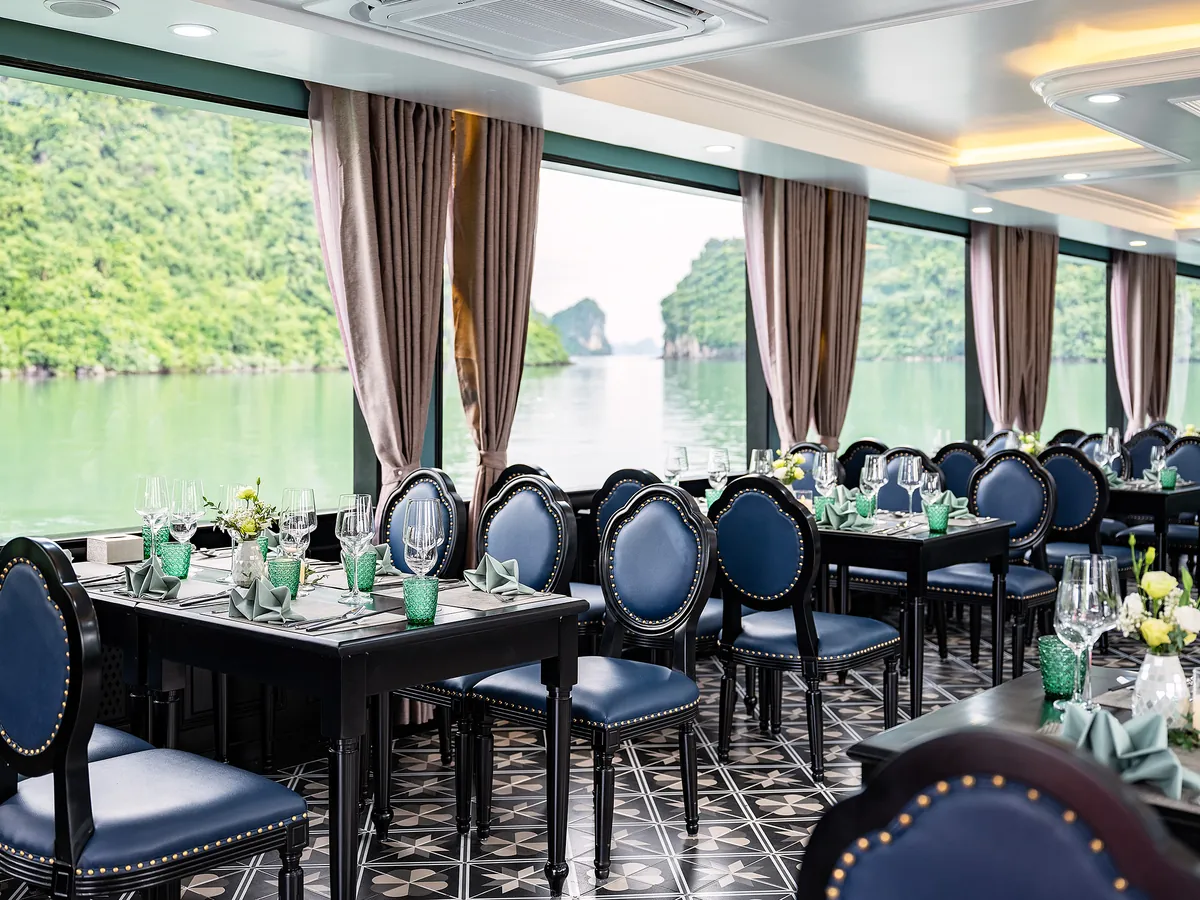 Guests enjoying lunch in Sea Lion Premium restaurant with limestone views